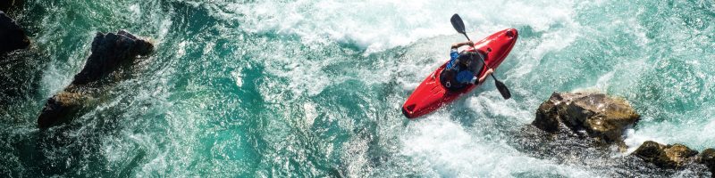 Mature Man Kayaking On  River Soca Rapids - High Angle View | VIACTIV Krankenkasse